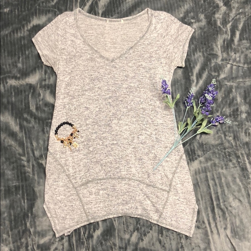 Long, light gray, short sleeved unique top.